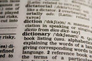 Translators and Narrators - black and white dictionary close up